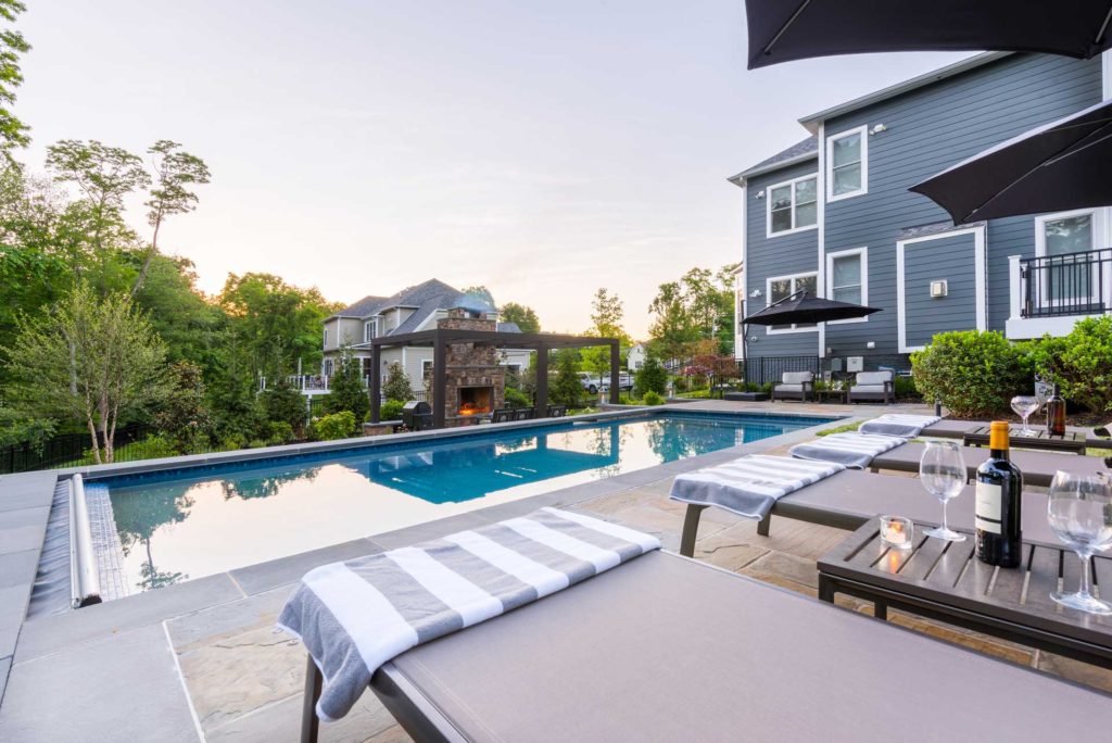 Luxury custom-built backyard in-ground pool & patio area in McLean, VA.