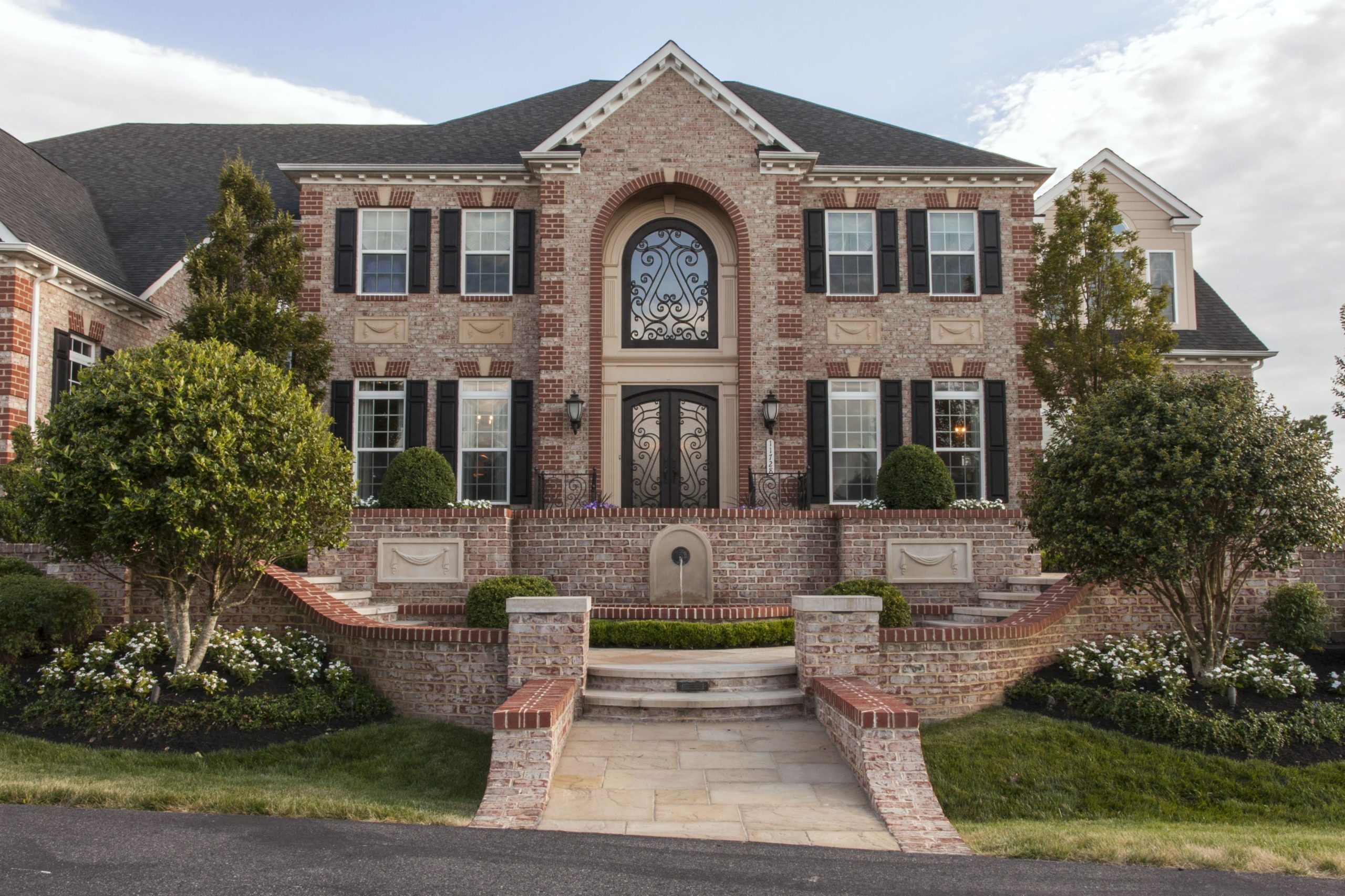 Front of house with tile path and landscaping