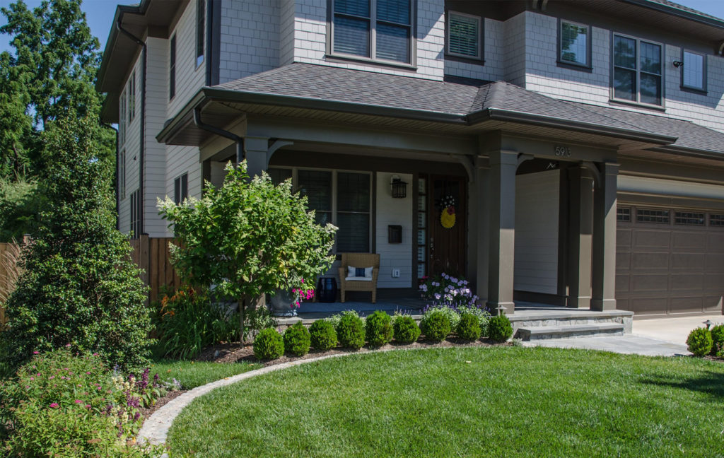 Well-manicured front yard of a two-story home