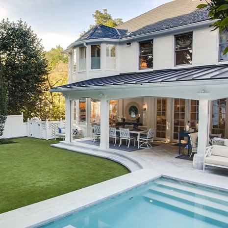 Backyard with a pool, outdoor furniture, and a grass yard