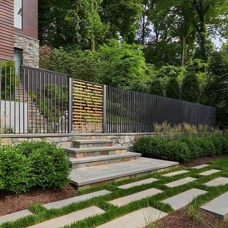 Front yard with bushes and a front gate