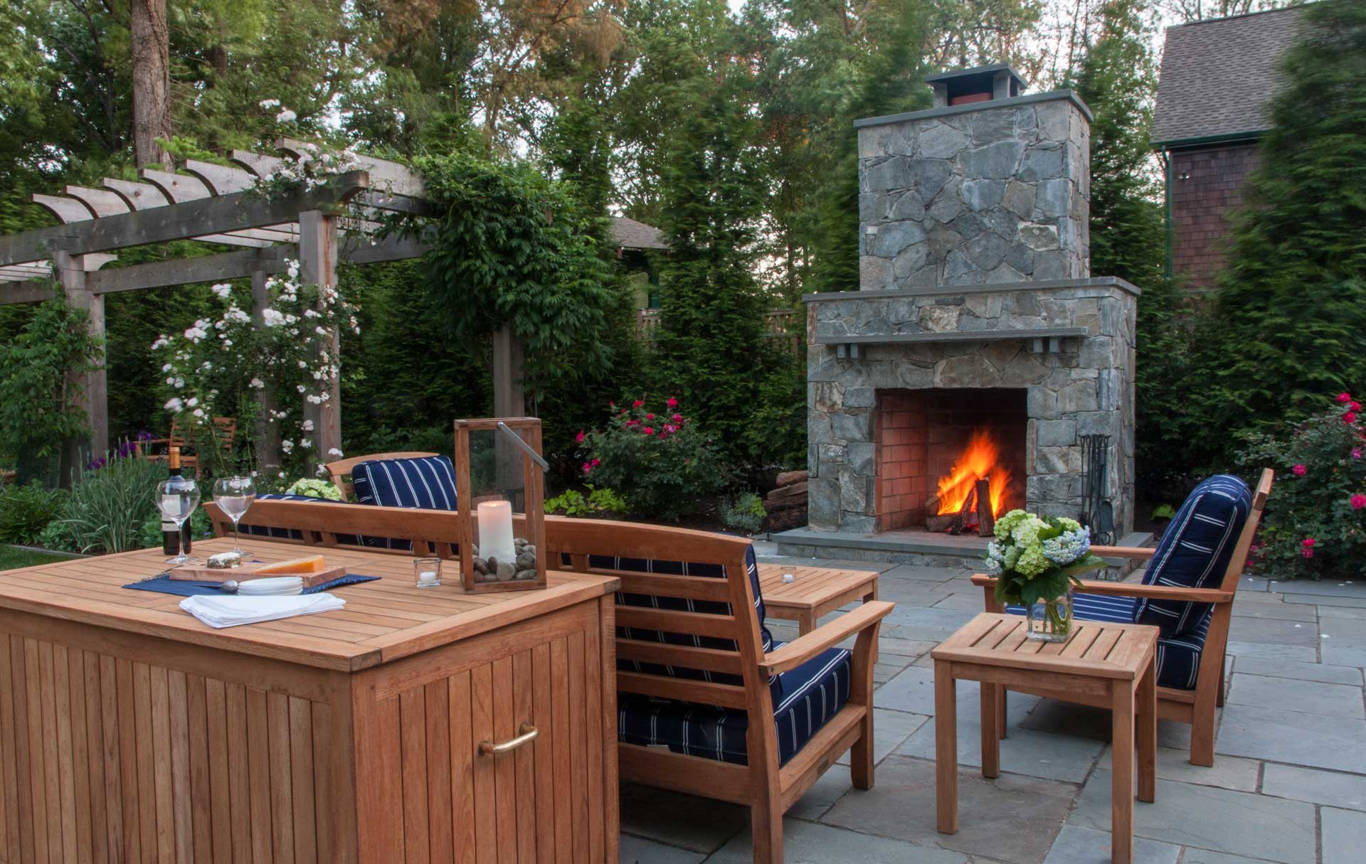 An inviting patio featuring a fire pit and comfortable outdoor furniture, creating a serene garden retreat.