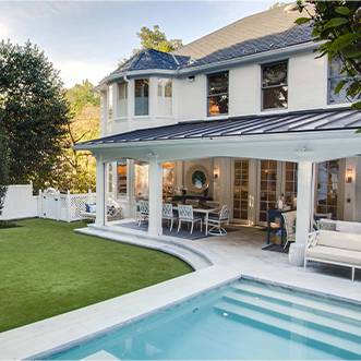 Backyard with a pool, outdoor furniture, and a grass yard