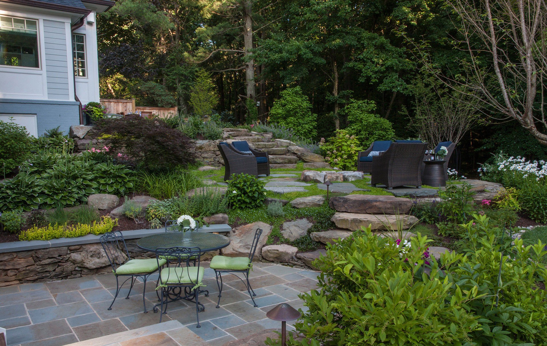 Tile Path in Backyard with outdoor furniture and fireplace