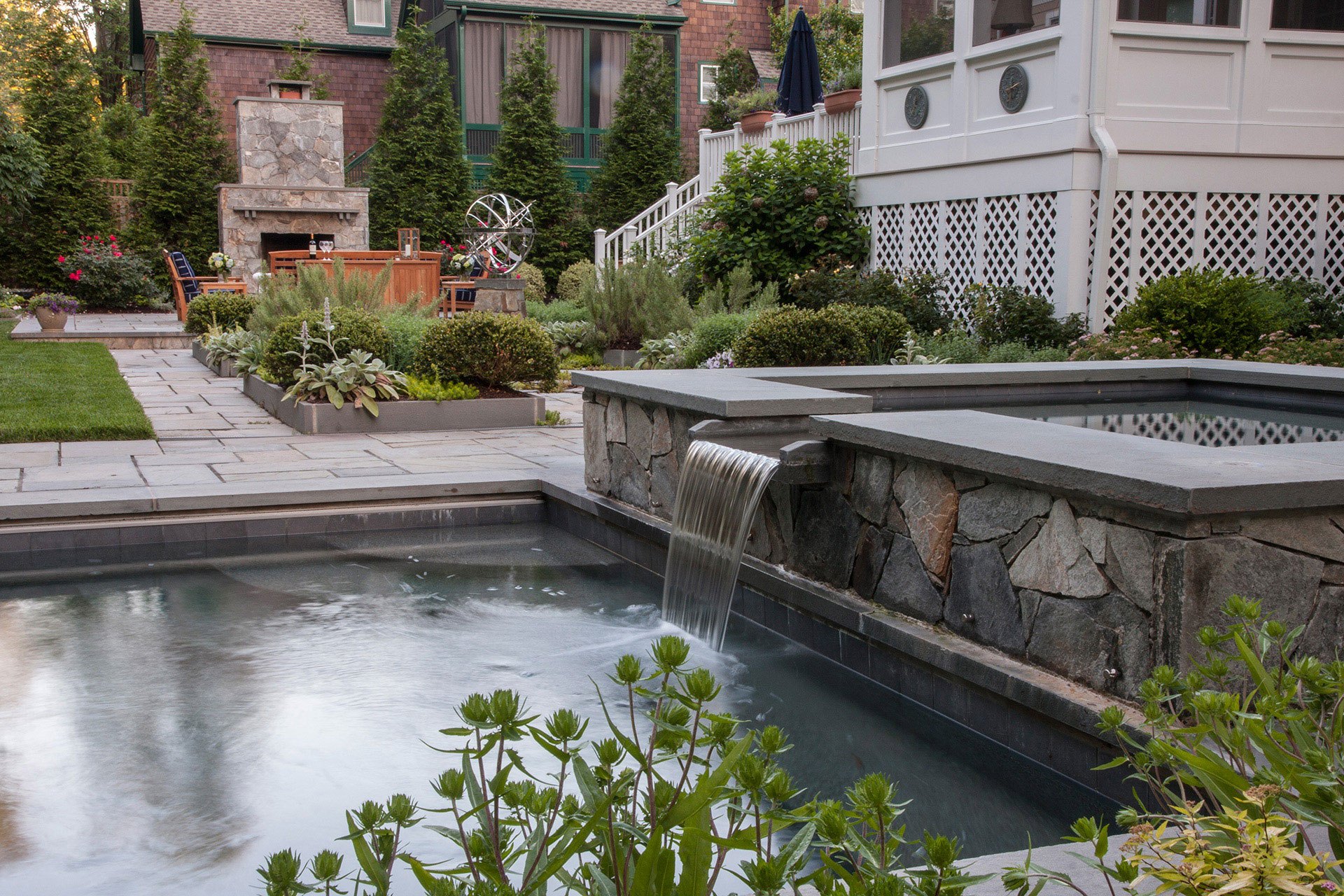 Backyard with Pool, Waterfall Feature, and Landscaped Area