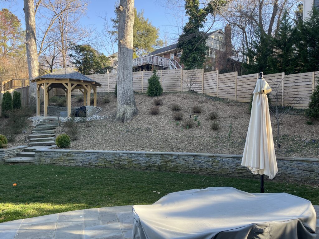 Sloped yard with retaining wall